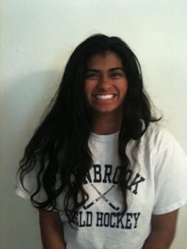 Aditi Pradhan Hometown: San Jose, CA_2011-2012 Class The second class of Teen Advisors (close angle headshot, but not a clear picture) a teen girl wearing her hockey white shirt with her smiley face facing the camera, and background is whit