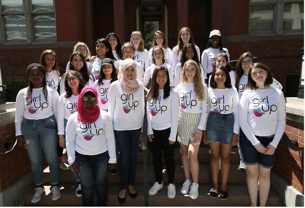 girl up group picture with smile wearing teen adviser shirt