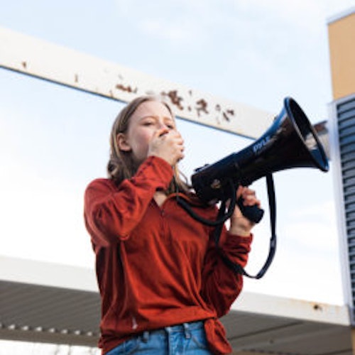 Eva Jones 2018-2019 Class Teen Advisors headshot (picture with her holding a loudspeaker)