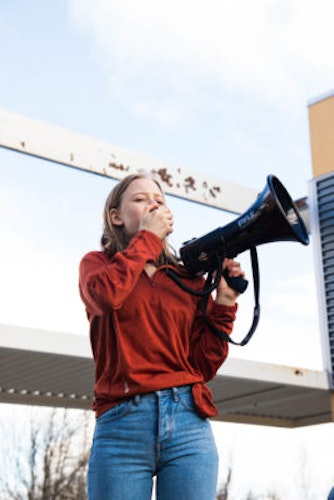 Eva Jones 2018-2019 Class Teen Advisors headshot (picture with her holding a loudspeaker)