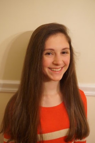 Katrina Sousounis 2016-2017 Teen Advisors ( long angle half-body, blurry pciture) with her smiley face facing the camera