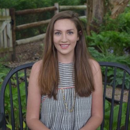 Meg Schwartz_2016-2017 Teen Advisors (close headshot) with her smiley face facing the camera, with background greenery grey
