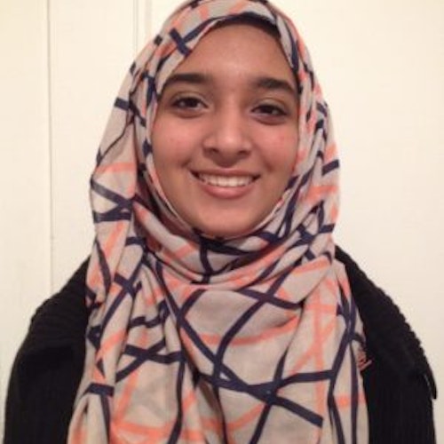Sabah Hussain_ 2015-2016 Teen Advisors (headshot) with her smiley face facing the camera wearing her grey color Hijab