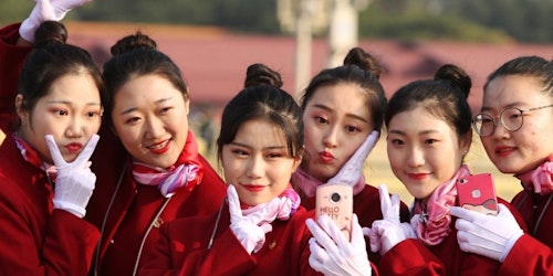 6 girls wearing red and pose for their selfie