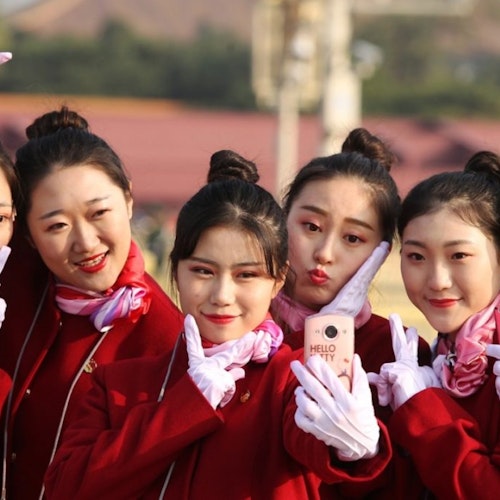6 girls wearing red and pose for their selfie