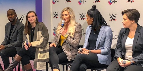 wwe-and-girl-up forum (5 people on the stage) WWE Superstar Charlotte is holding a mic facing to the front