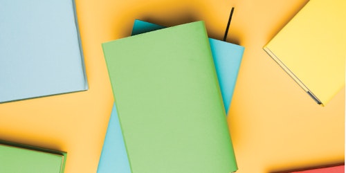 desenho gráfico com um livro verde e azul