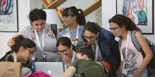 WiSci Girls STEAM Camp participants at a computer.