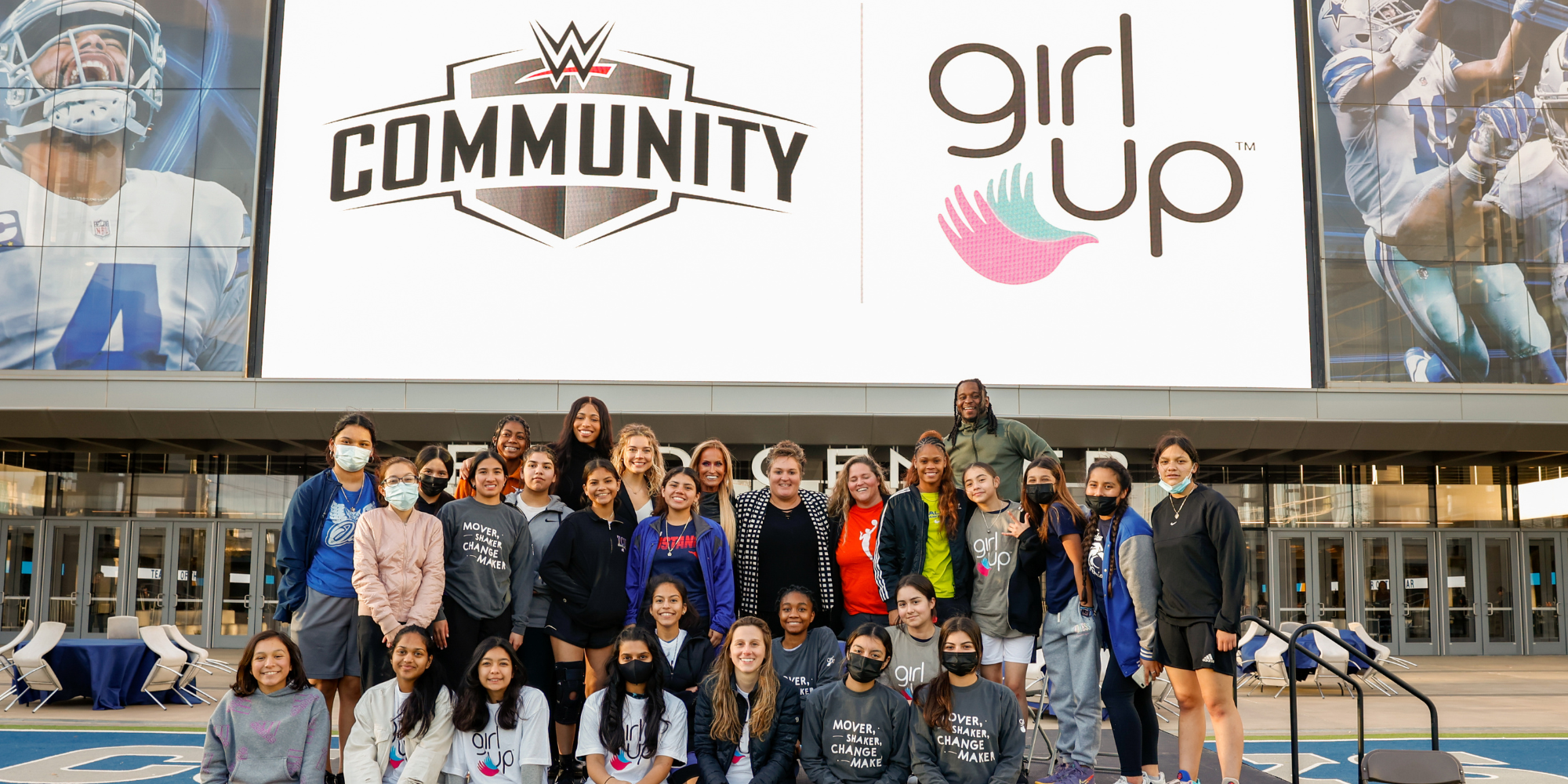 Group of Girl Up Leaders and WWE Stars smiling